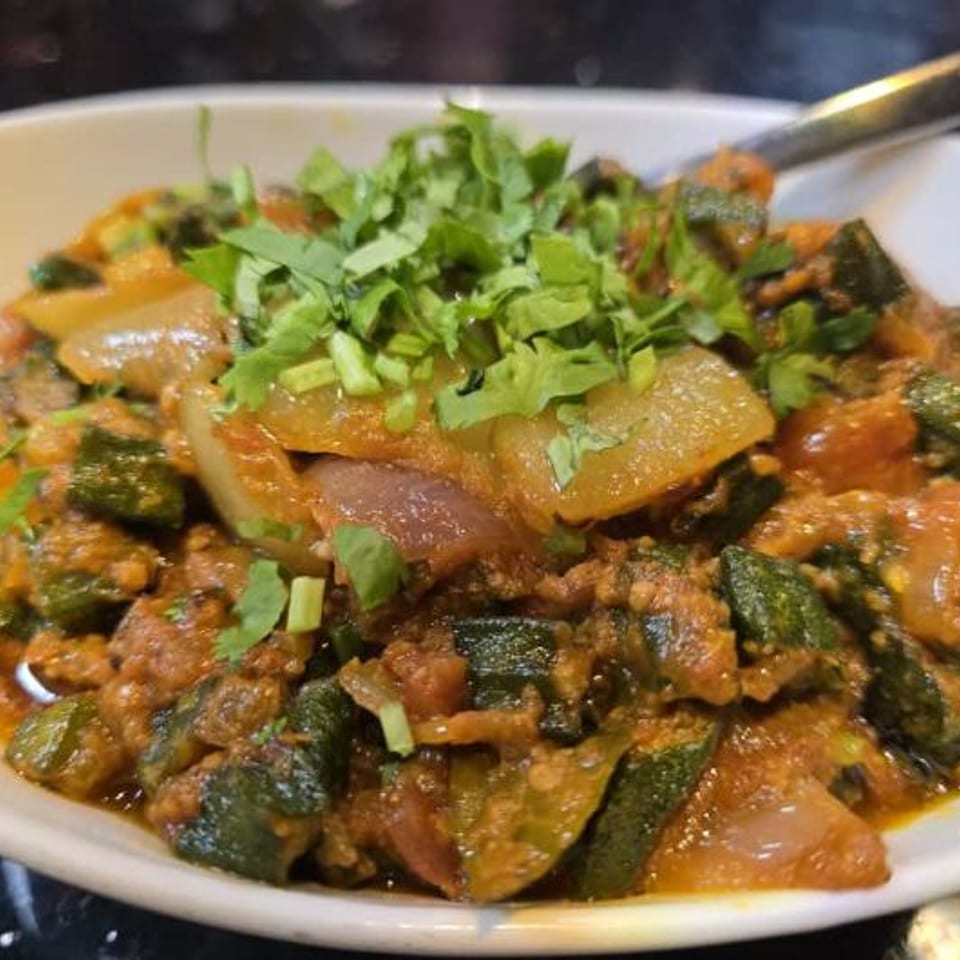 Vegetable dish garnished with fresh cilantro.
